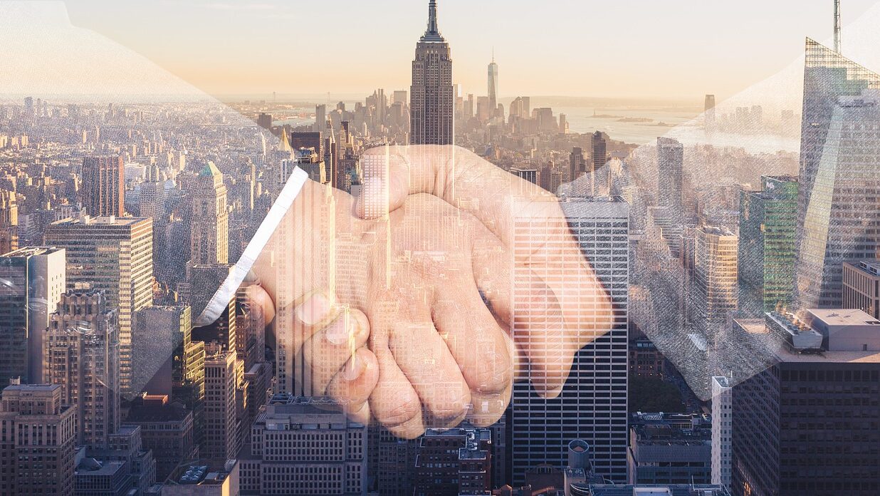 shaking hands, handshake, skyline-3096229.jpg